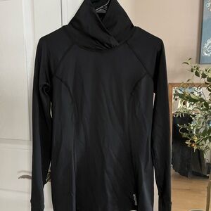 Reebok workout top. Long sleeved with thumb hole. Unique neckline.